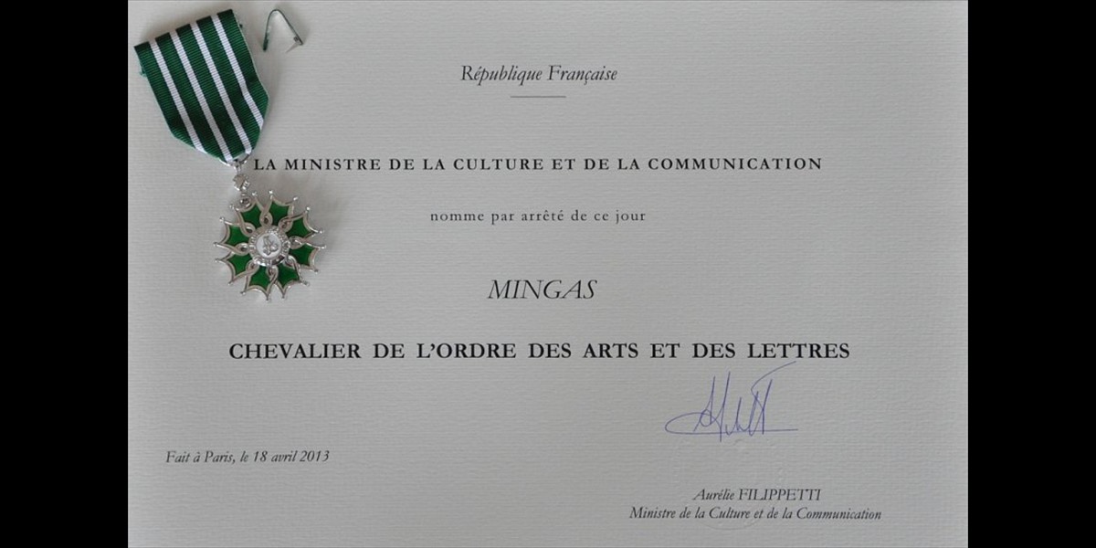 December, 2013:  Mingas receiving insignia as  <i>'Chevalier dans l'Ordre National des Arts et des Lettres'</i> (photo by ps)